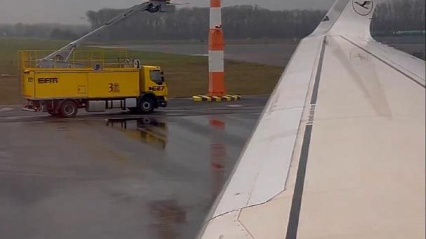 Spraying planes with a yellow material before takeoff